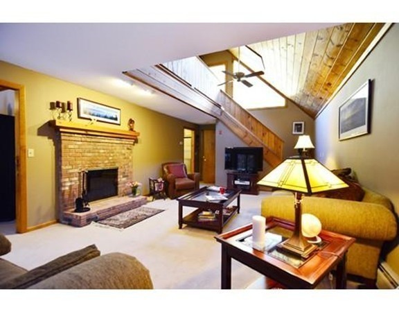 556 Burts Pit Road Northampton, MA 01062 - Photo 3 of 24 a living room with furniture a rug and a fireplace