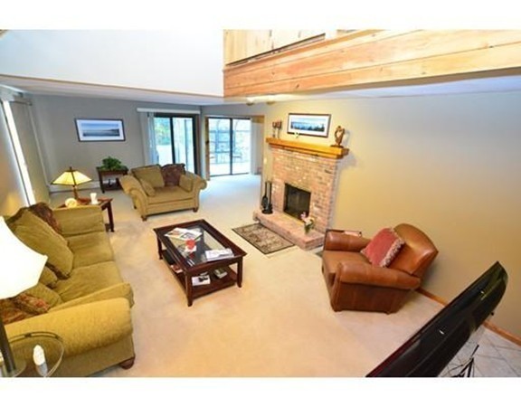 556 Burts Pit Road Northampton, MA 01062 - Photo 9 of 24 a living room with furniture and a fireplace