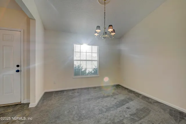 a view of empty room with windows