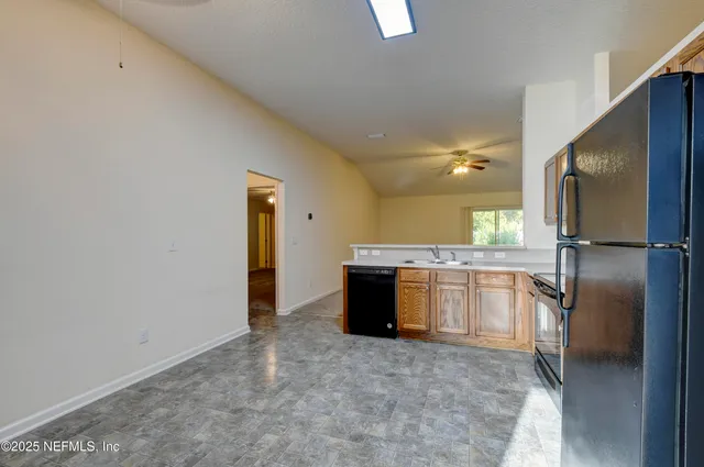 a view of a kitchen with a sink