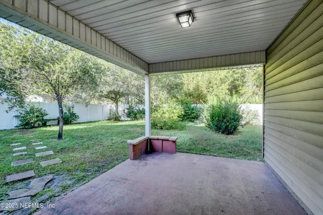 a view of backyard with green space
