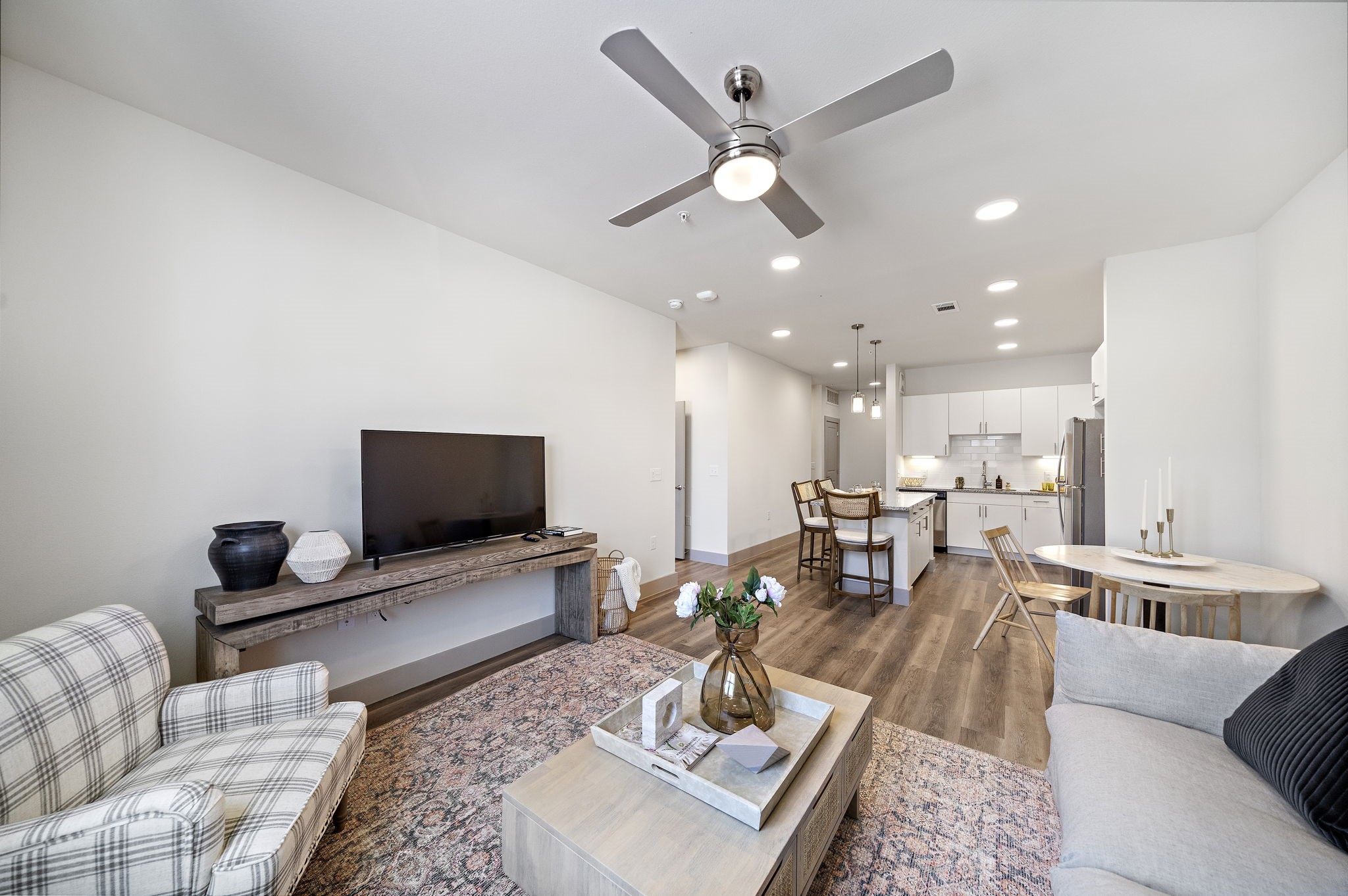 10485 League Line Road, Unit 1201 Conroe, TX 77304 - Photo 3 of 10 a living room with furniture and a flat screen tv