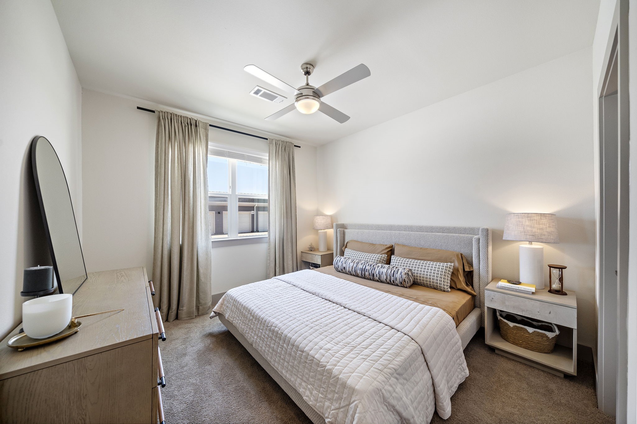 10485 League Line Road, Unit 1201 Conroe, TX 77304 - Photo 5 of 10 a bedroom with a bed and a flat tv screen on a dresser