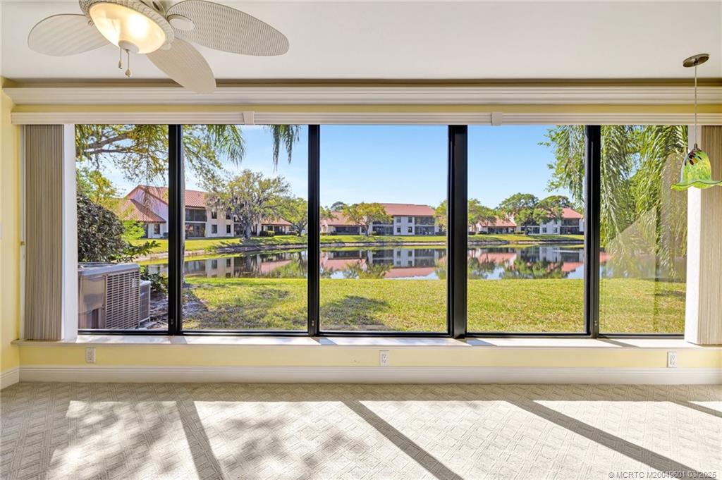 6040 Southeast Martinique Drive, Unit 102 Stuart, FL 34997 - Photo 18 of 52 a view of a large window with an outdoor view
