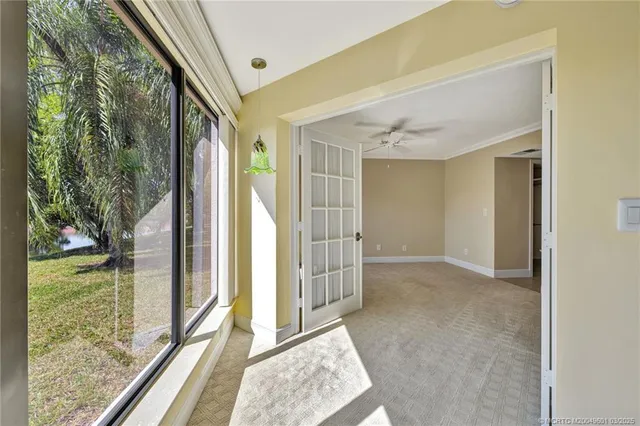 a view of an empty room with a window