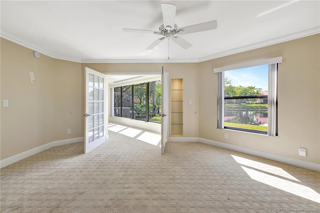 6040 Southeast Martinique Drive, Unit 102 Stuart, FL 34997 - Photo 23 of 52 a view of an empty room with a window