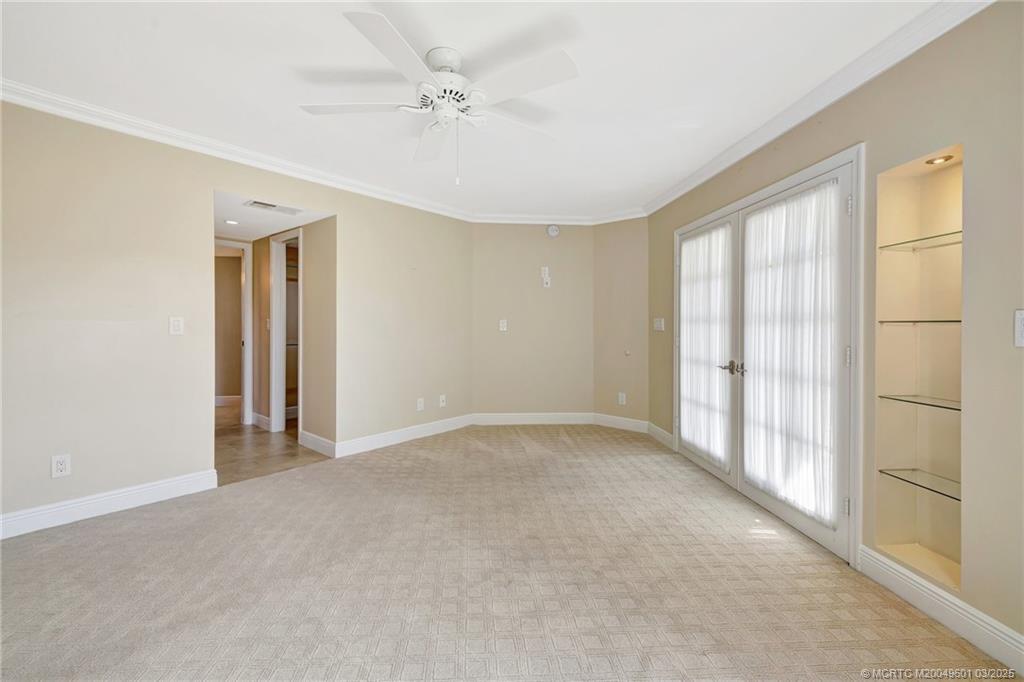 6040 Southeast Martinique Drive, Unit 102 Stuart, FL 34997 - Photo 25 of 52 a view of an empty room with a window
