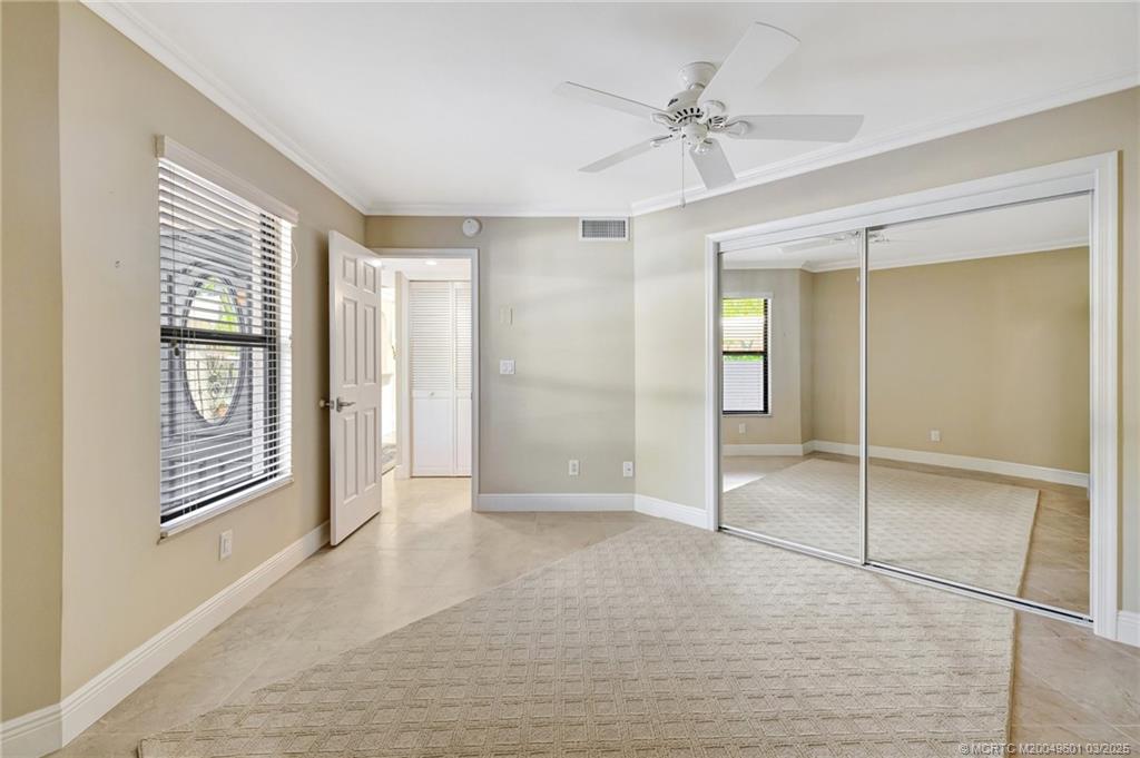 6040 Southeast Martinique Drive, Unit 102 Stuart, FL 34997 - Photo 31 of 52 a view of an empty room with a window