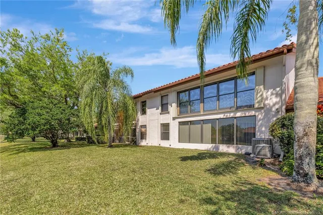 front view of a house with a garden