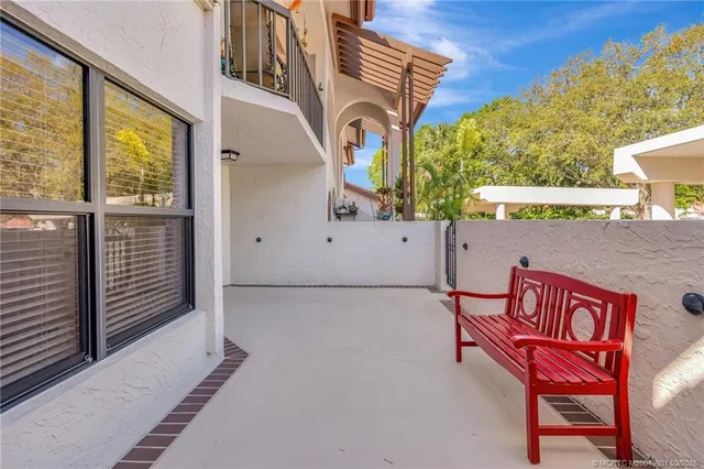 a view of a patio with a table and chairs