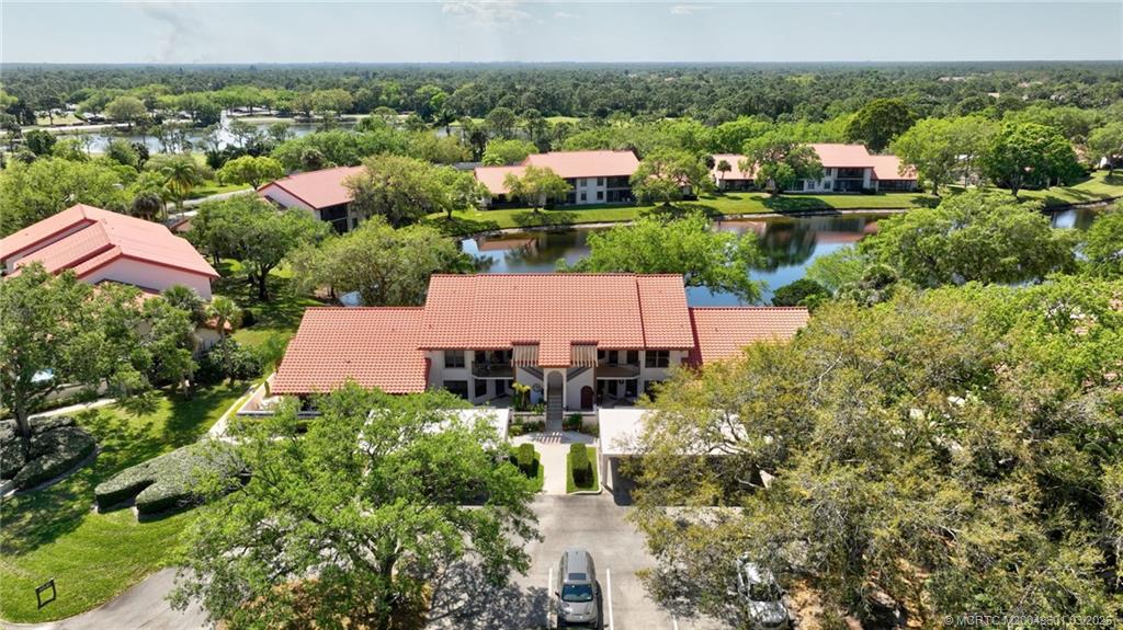 6040 Southeast Martinique Drive, Unit 102 Stuart, FL 34997 - Photo 42 of 52 an aerial view of multiple house