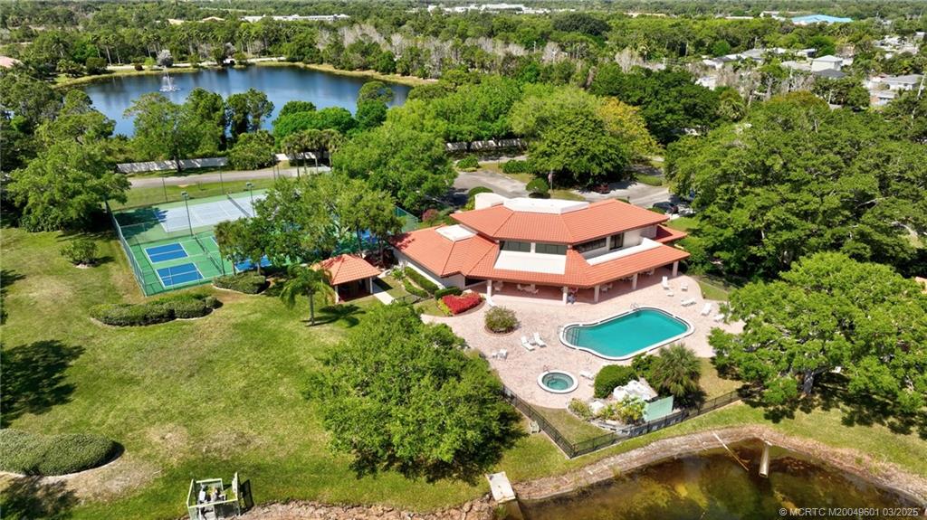 6040 Southeast Martinique Drive, Unit 102 Stuart, FL 34997 - Photo 51 of 52 an aerial view of house with yard swimming pool and outdoor seating