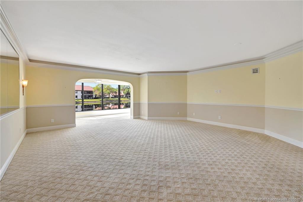 6040 Southeast Martinique Drive, Unit 102 Stuart, FL 34997 - Photo 8 of 52 a view of an empty room with a window