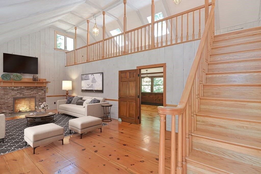 125 Westboro Road Upton, MA 01568 - Photo 12 of 41 a living room with fireplace furniture and a flat screen tv