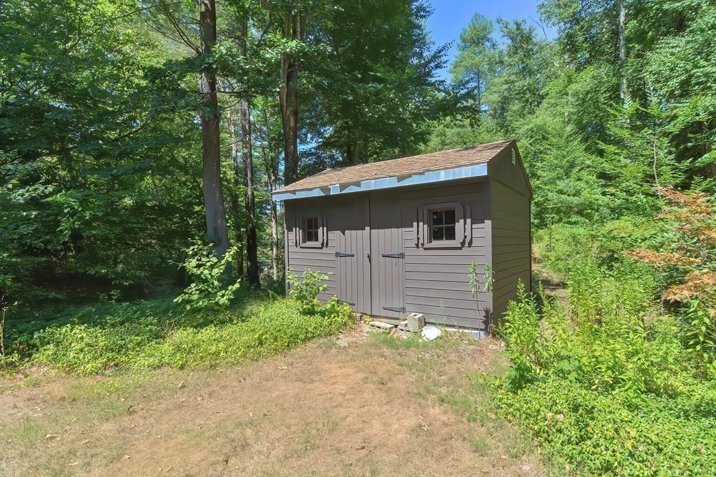 125 Westboro Road Upton, MA 01568 - Photo 37 of 41 a front view of a house with a garden