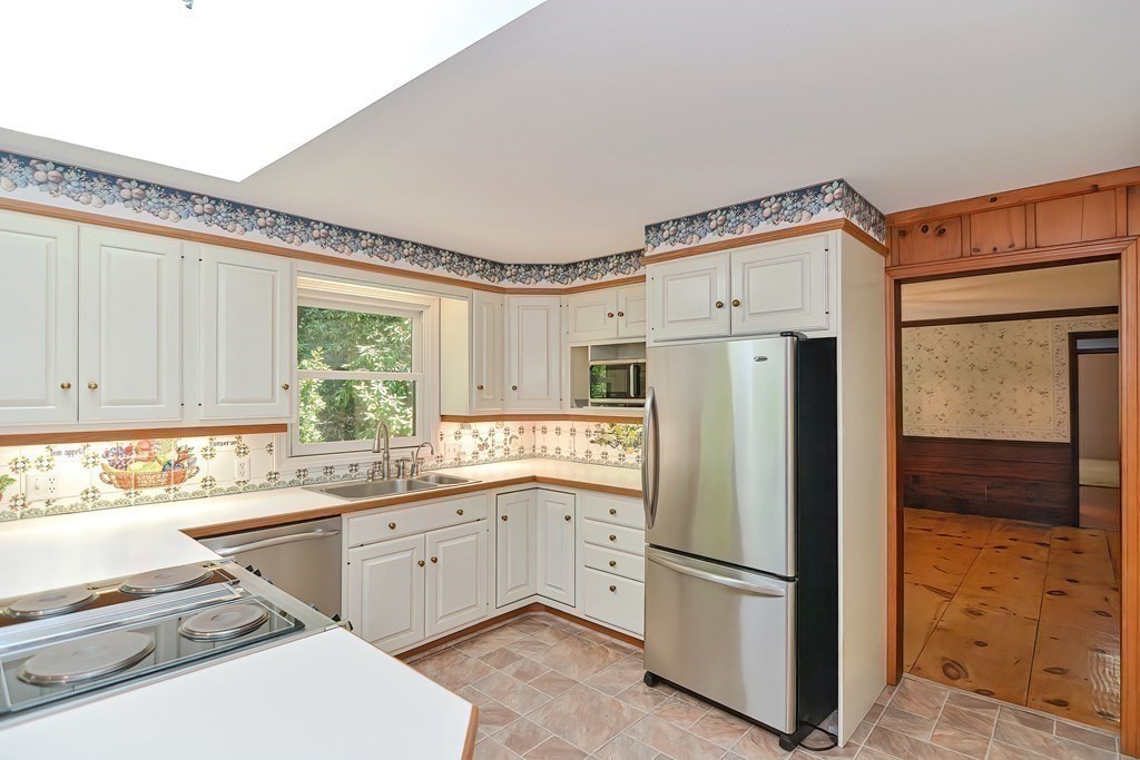 125 Westboro Road Upton, MA 01568 - Photo 8 of 41 a white refrigerator freezer sitting inside of a kitchen