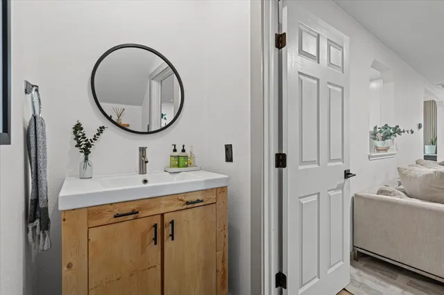 a bathroom with a sink and a mirror