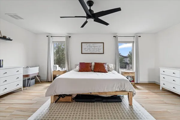 a bedroom with a bed and a window