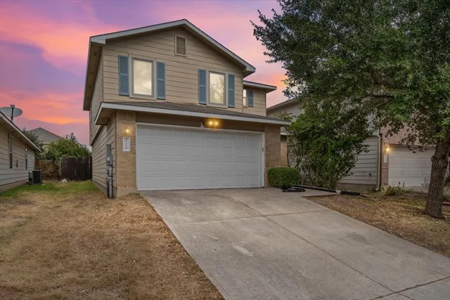a view of a backyard with table and chairs and a fire pit
