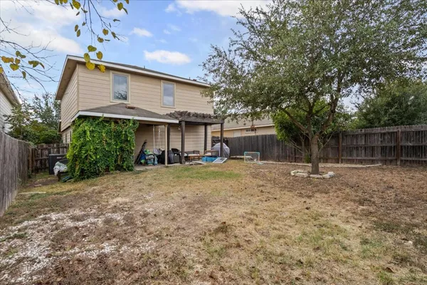 a view of a backyard of the house