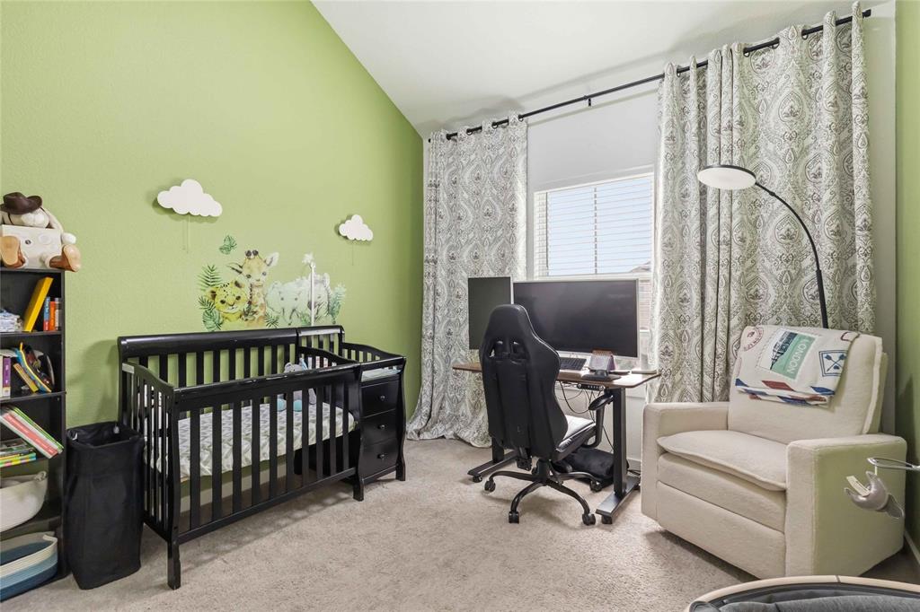 1128 Queensdown Way Forney, TX 75126 - Photo 27 of 30 Room featuring a window with blinds and patterned drapes, a sloped ceiling, and carpet flooring