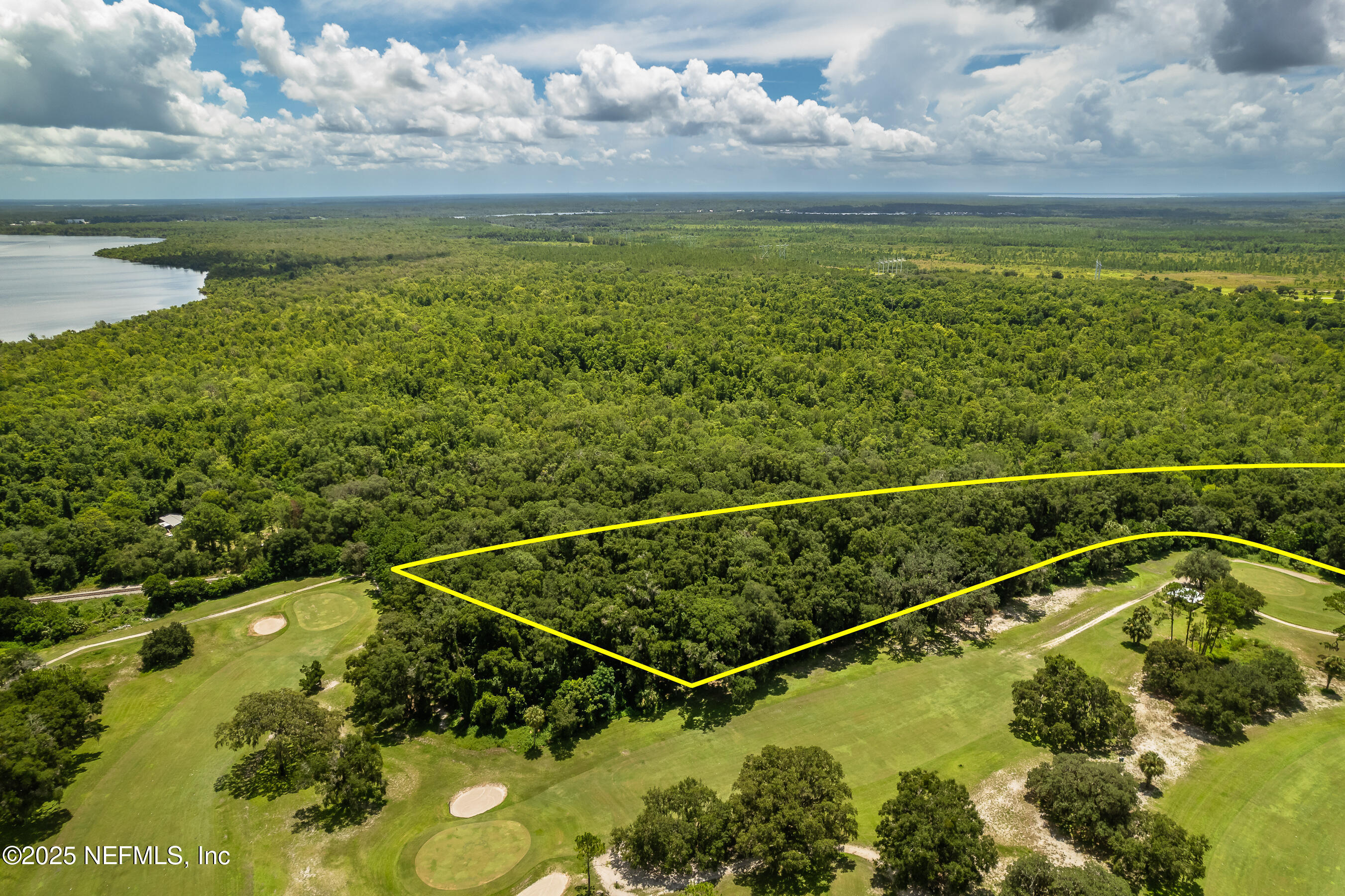 0 Lundy Road Palatka, FL 32177 - Photo 5 of 6 a view of a swimming pool with a patio and a lake view
