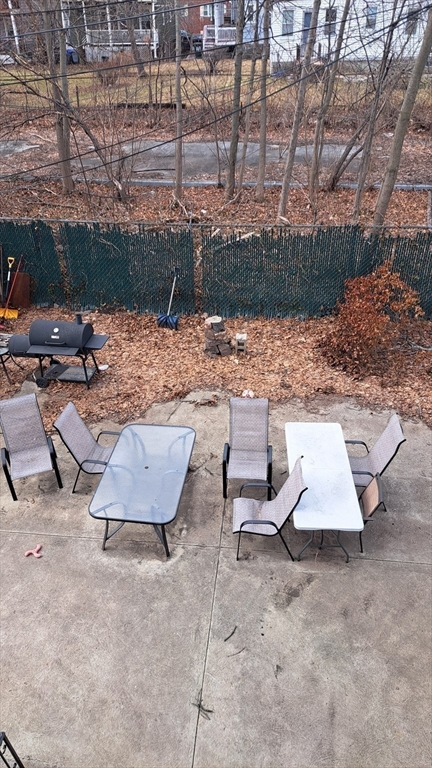 7 Samoset Street, Unit 2 Boston, MA 02124 - Photo 10 of 12 a view of a patio with a table and chairs