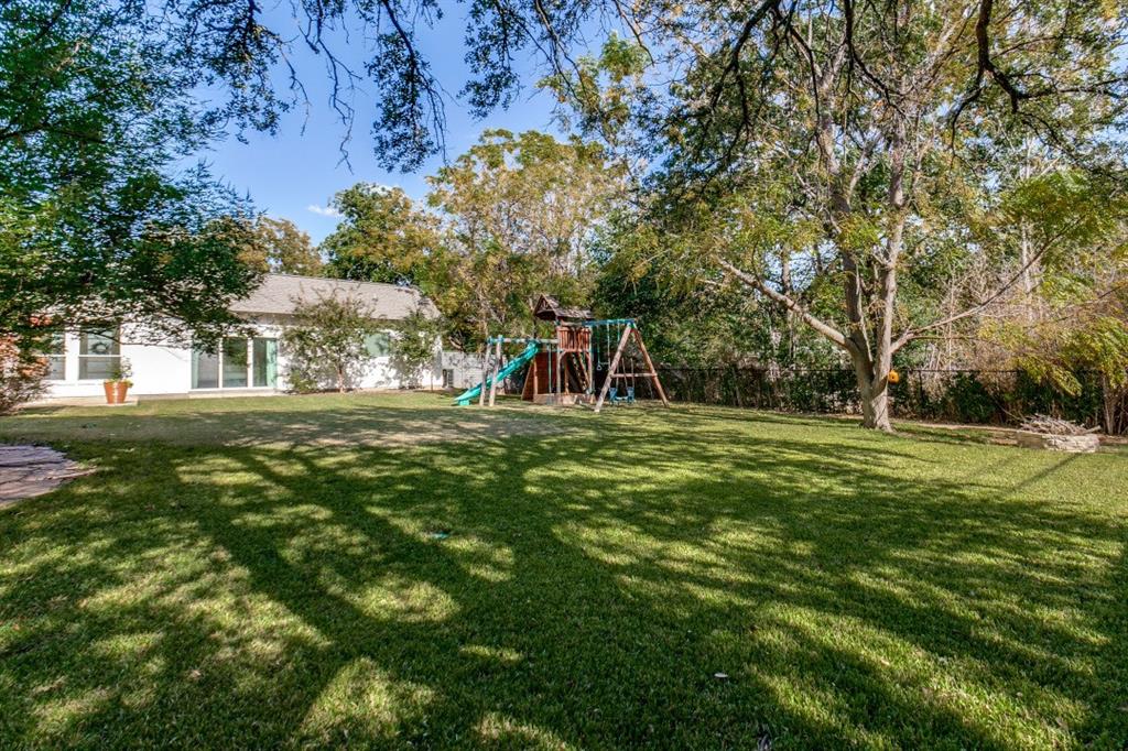 4206 Manning Lane Dallas, TX 75220 - Photo 34 of 35 a front view of a house with a yard