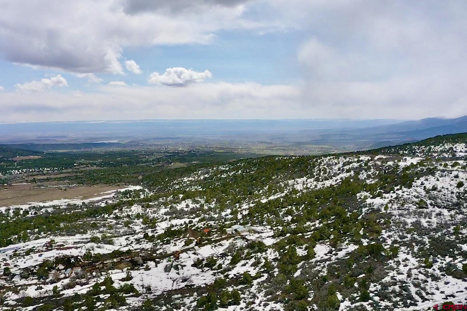 25137 Starner Loop Road Cedaredge, CO 81413 - Photo 22 of 33 a view of a bunch of trees and houses