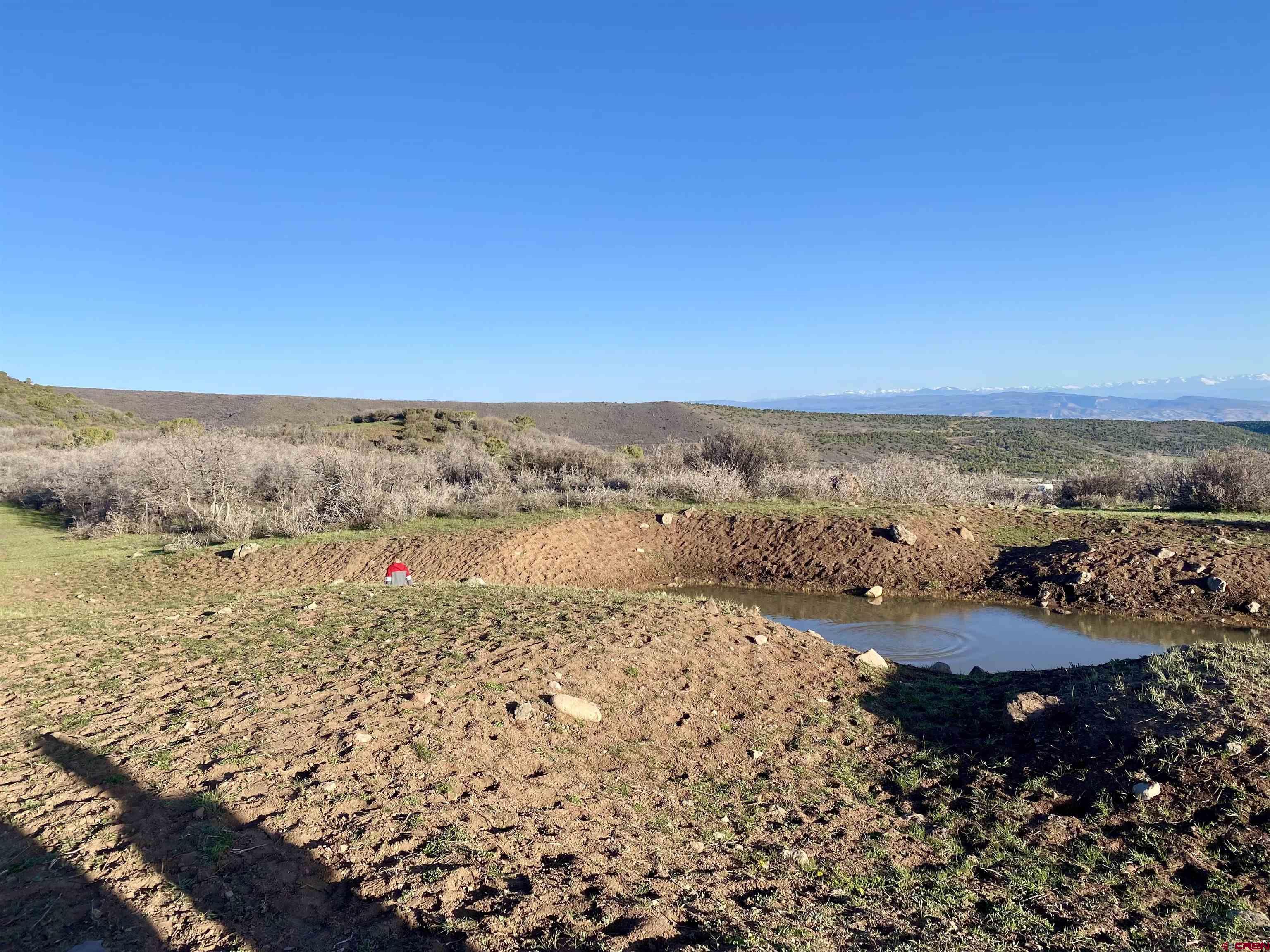 25137 Starner Loop Road Cedaredge, CO 81413 - Photo 26 of 33 a view of ocean with beach