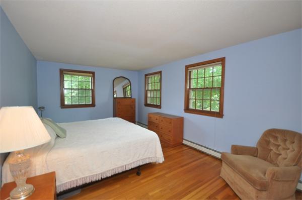 17 Middle Street Lexington, MA 02421 - Photo 11 of 13 a bedroom with a bed and window