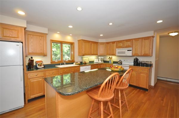 17 Middle Street Lexington, MA 02421 - Photo 5 of 13 a large kitchen with granite countertop a large counter top stainless steel appliances and cabinets