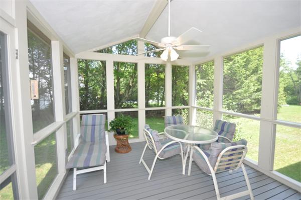 17 Middle Street Lexington, MA 02421 - Photo 7 of 13 a view of a dining room with furniture large windows and wooden floor