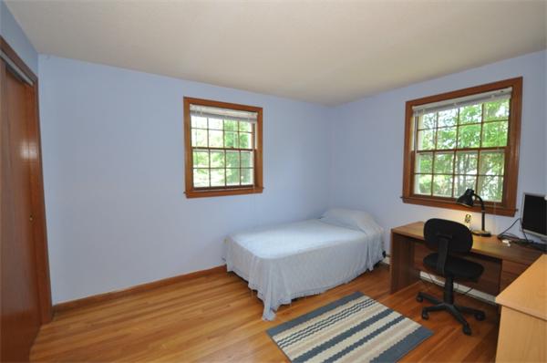 17 Middle Street Lexington, MA 02421 - Photo 10 of 13 a bedroom with a bed table chair and a window