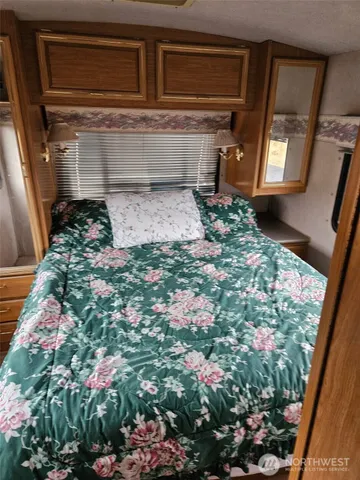 a kitchen with a stove and a refrigerator