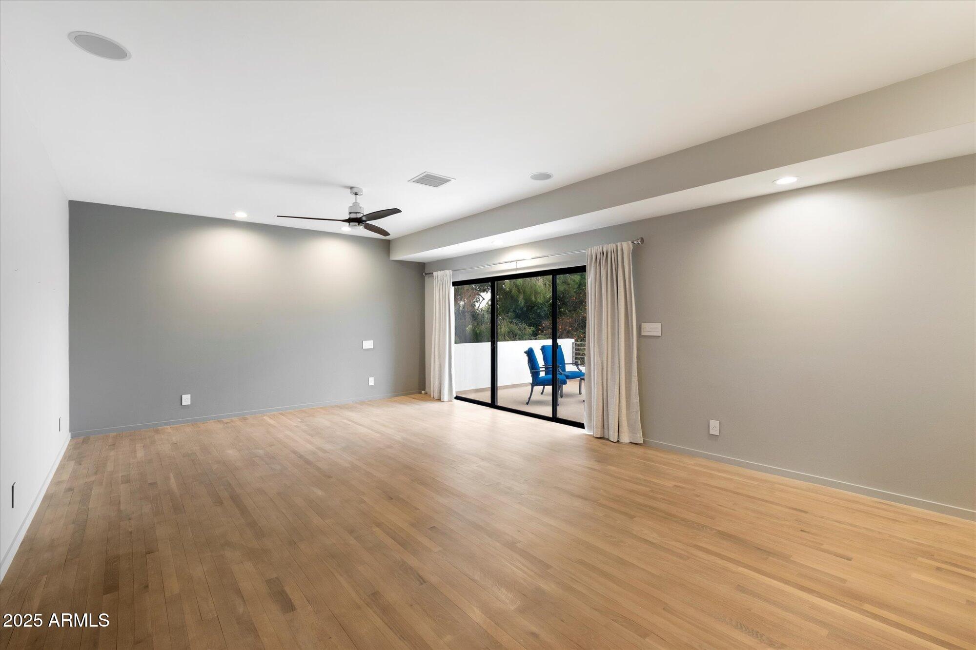 25 West Frier Drive Phoenix, AZ 85021 - Photo 19 of 43 a view of a livingroom with a ceiling fan and window