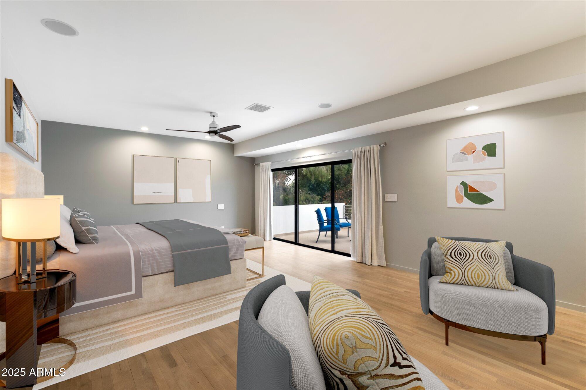 25 West Frier Drive Phoenix, AZ 85021 - Photo 20 of 43 a spacious bedroom with a bed a couch and a lamp on table