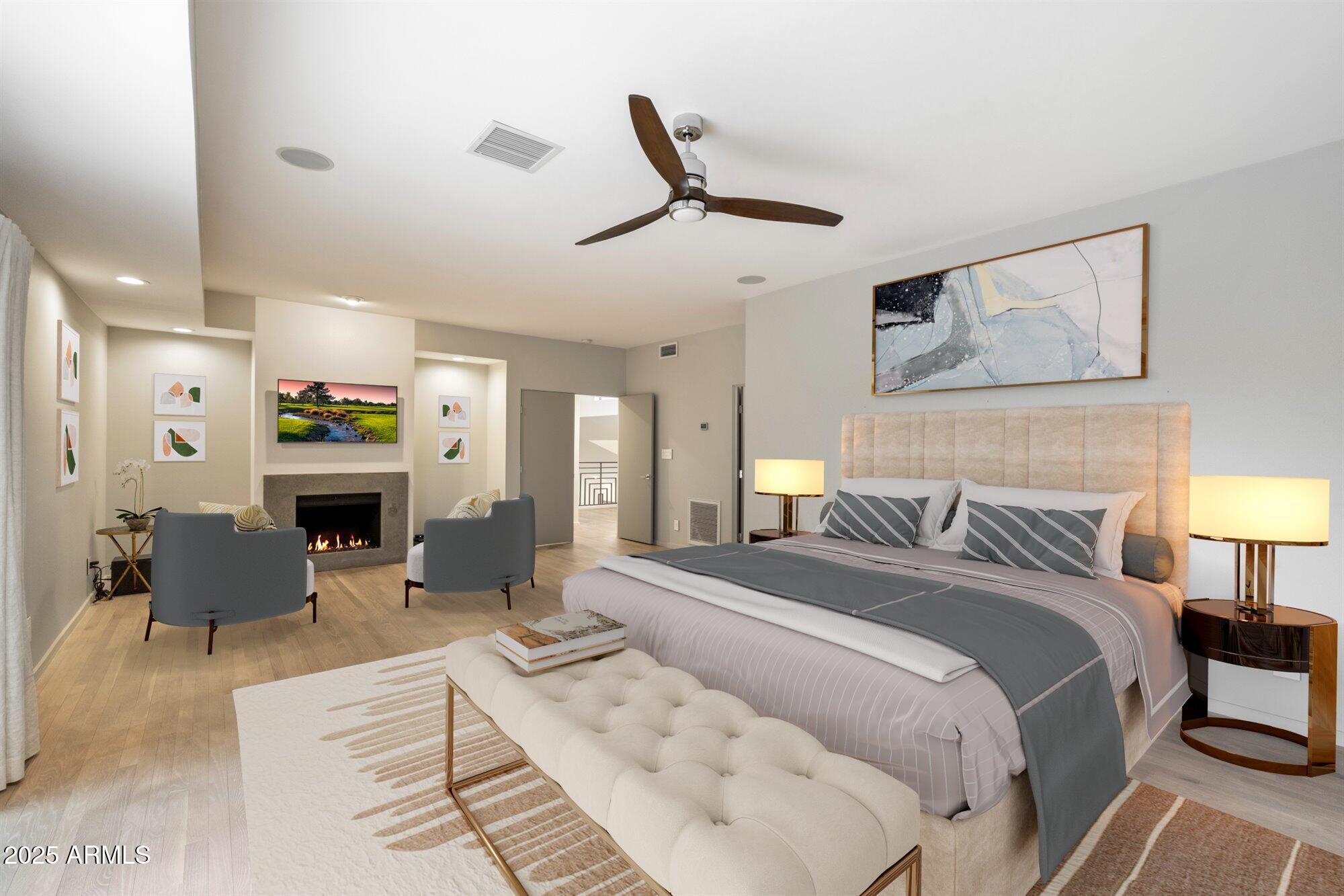 25 West Frier Drive Phoenix, AZ 85021 - Photo 22 of 43 a spacious bedroom with a bed a couch and a chandelier