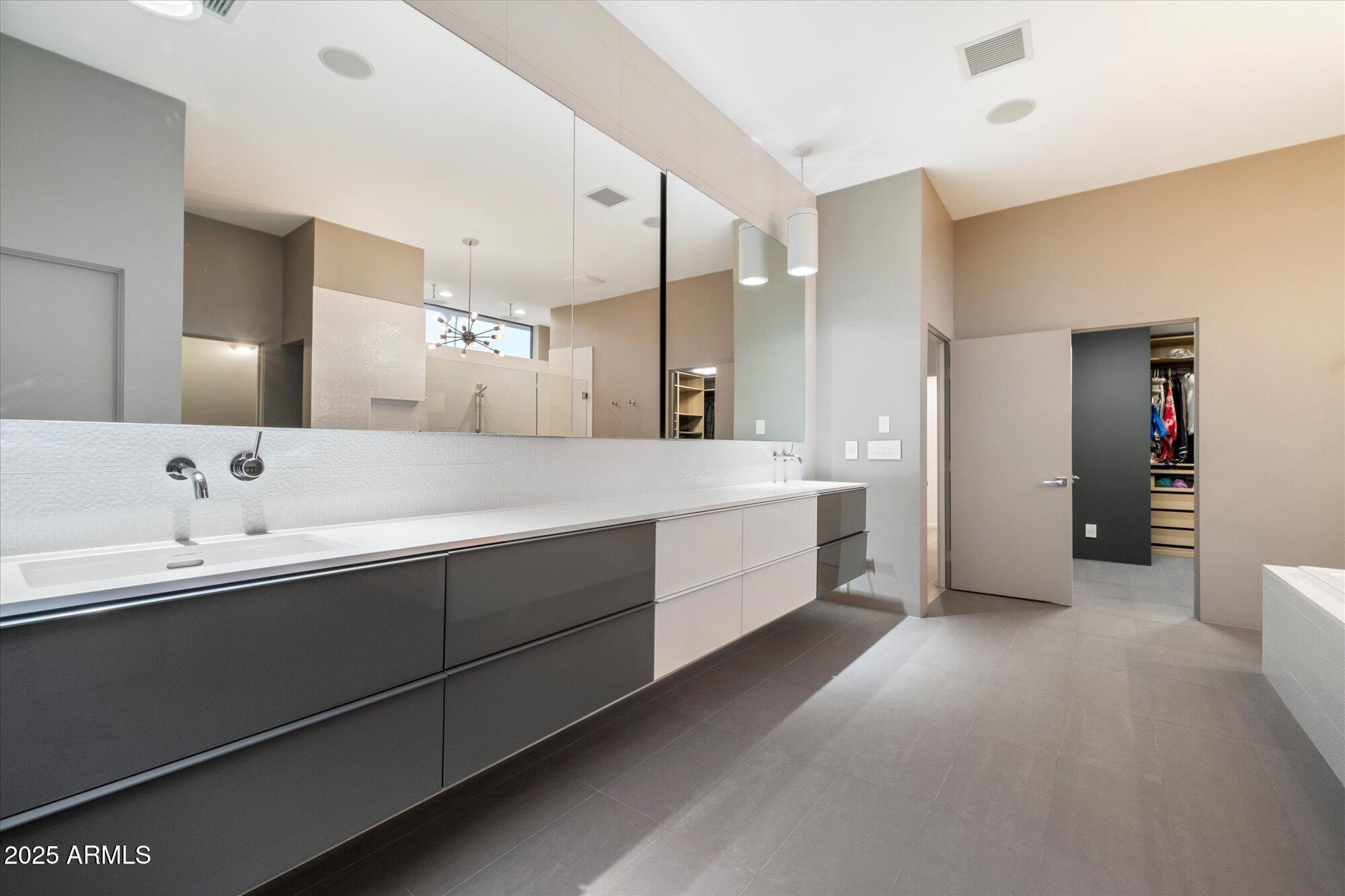 25 West Frier Drive Phoenix, AZ 85021 - Photo 24 of 43 a large bathroom with a double vanity sink mirror and shower
