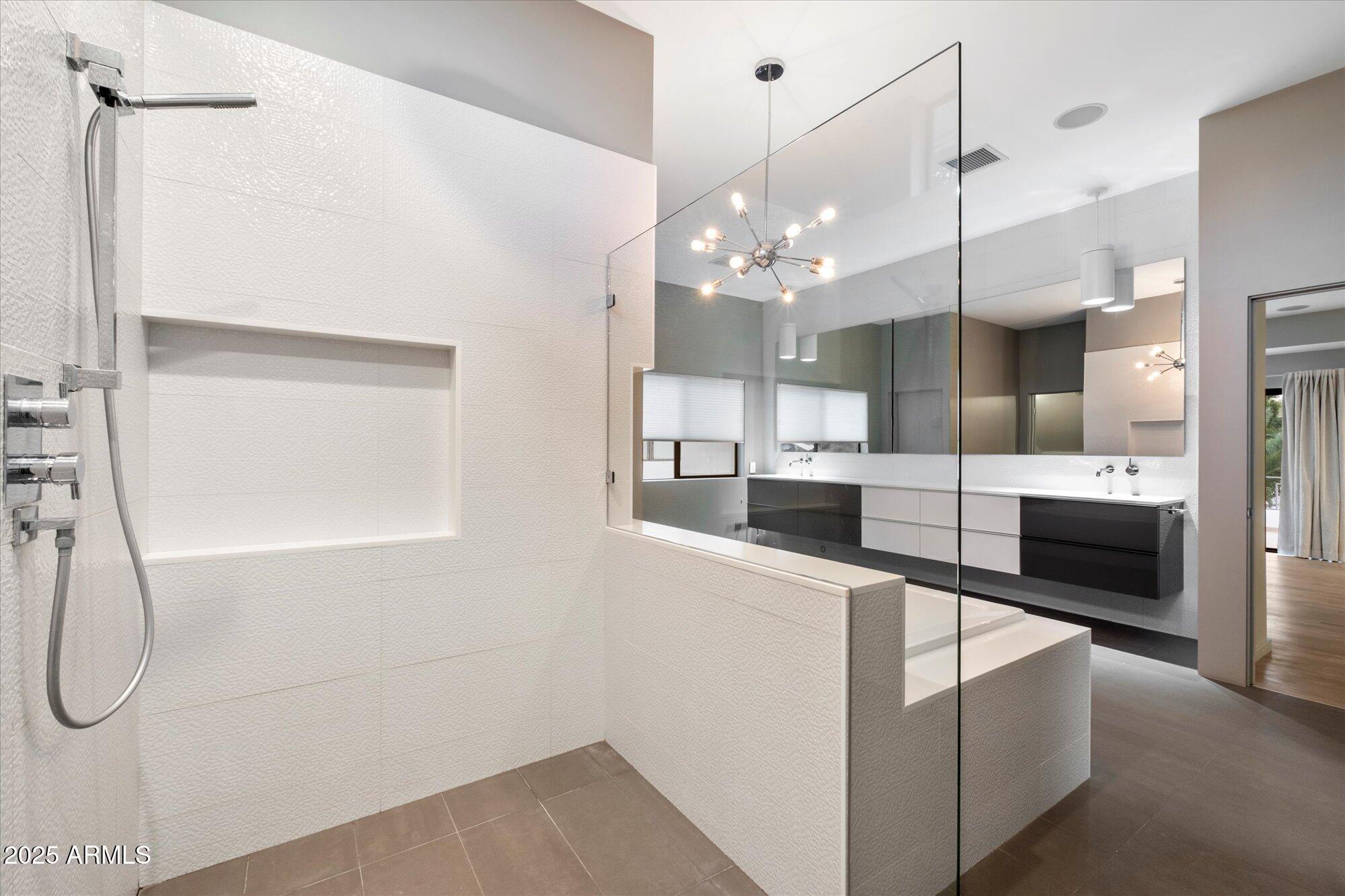 25 West Frier Drive Phoenix, AZ 85021 - Photo 25 of 43 a kitchen with stainless steel appliances a refrigerator a sink and white cabinets