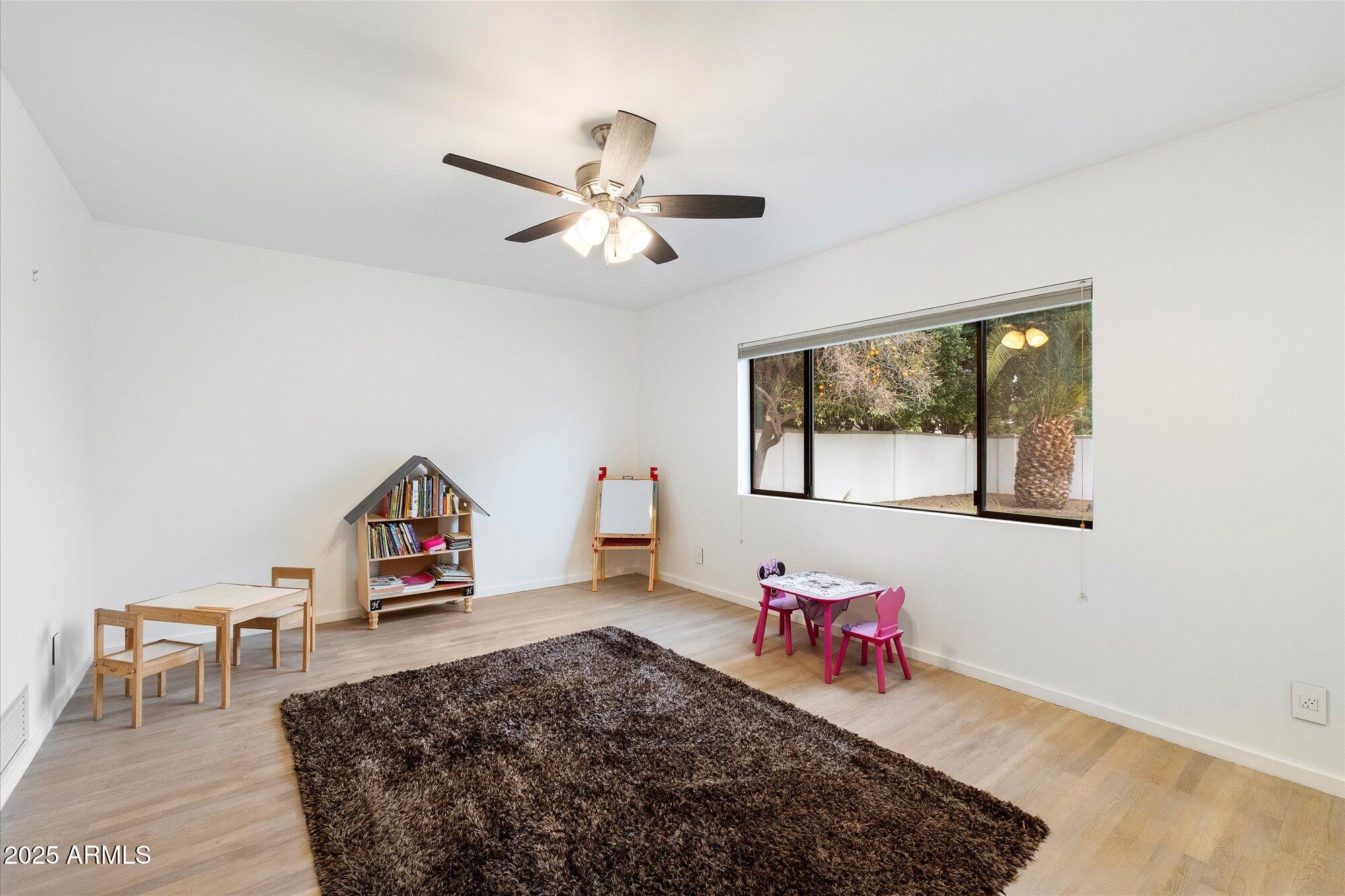 25 West Frier Drive Phoenix, AZ 85021 - Photo 28 of 43 a living room with furniture and a wooden floor
