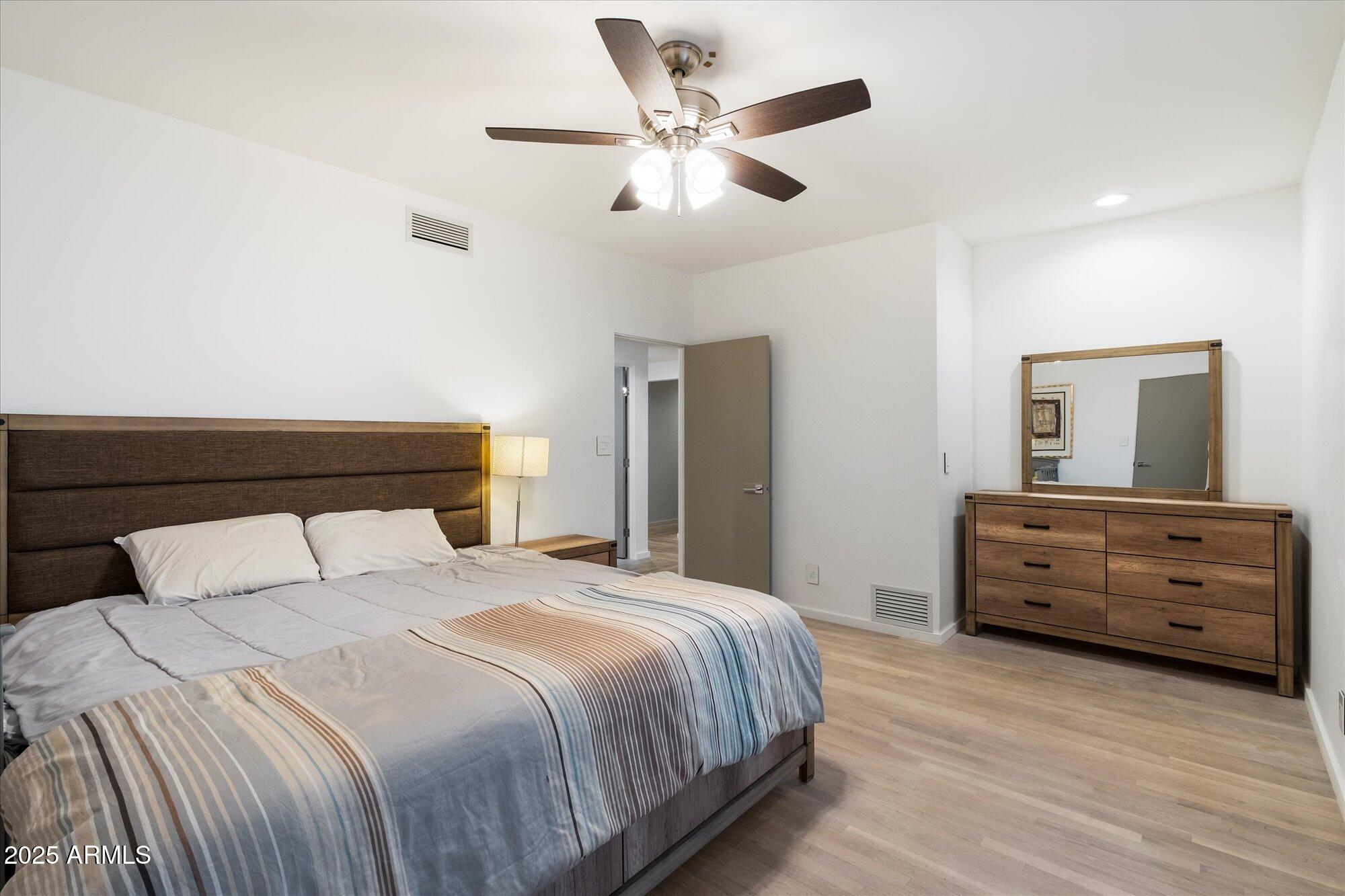 25 West Frier Drive Phoenix, AZ 85021 - Photo 30 of 43 a bedroom with a bed and a dresser