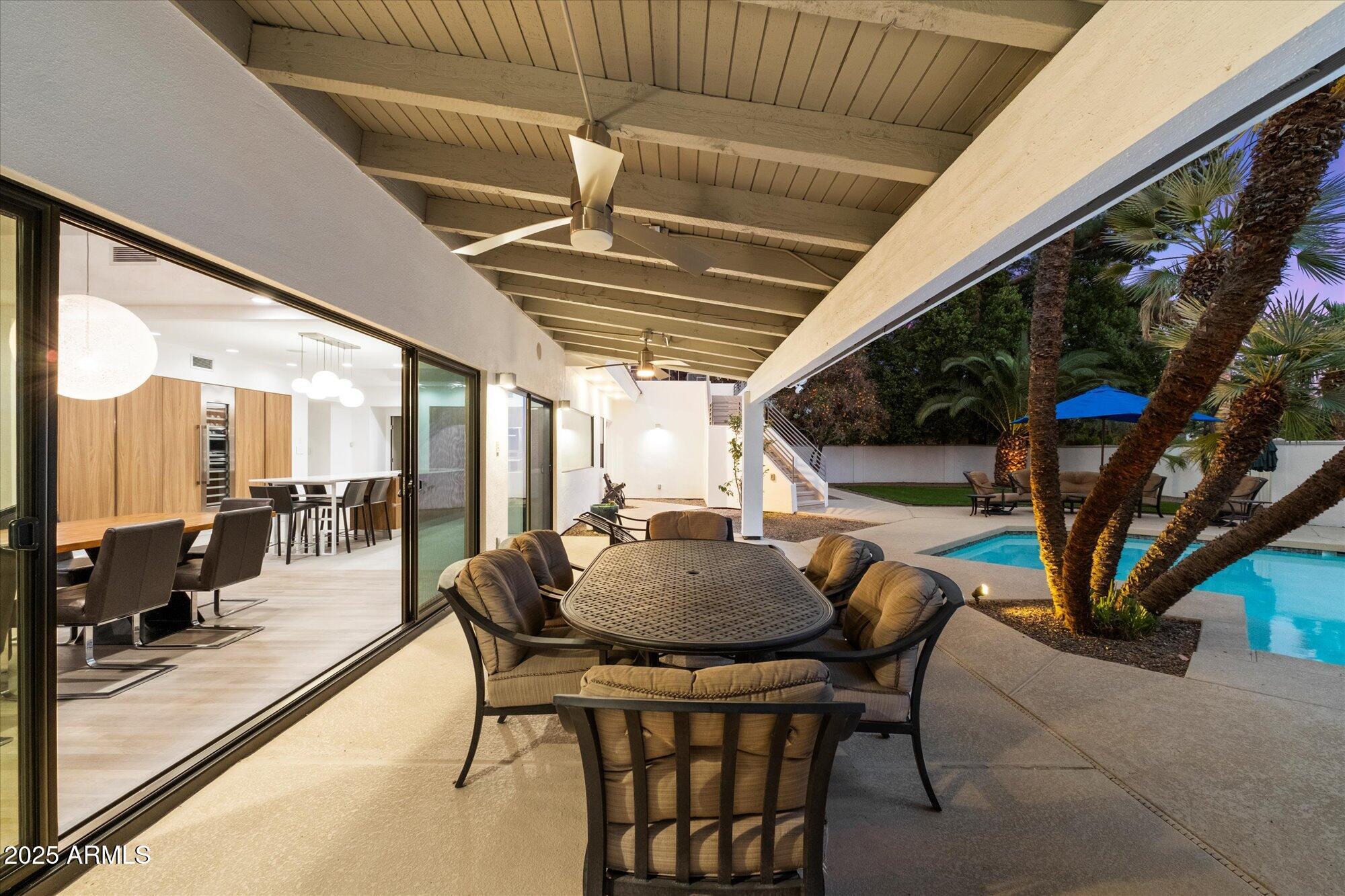 25 West Frier Drive Phoenix, AZ 85021 - Photo 34 of 43 a dining room with furniture and a floor to ceiling window