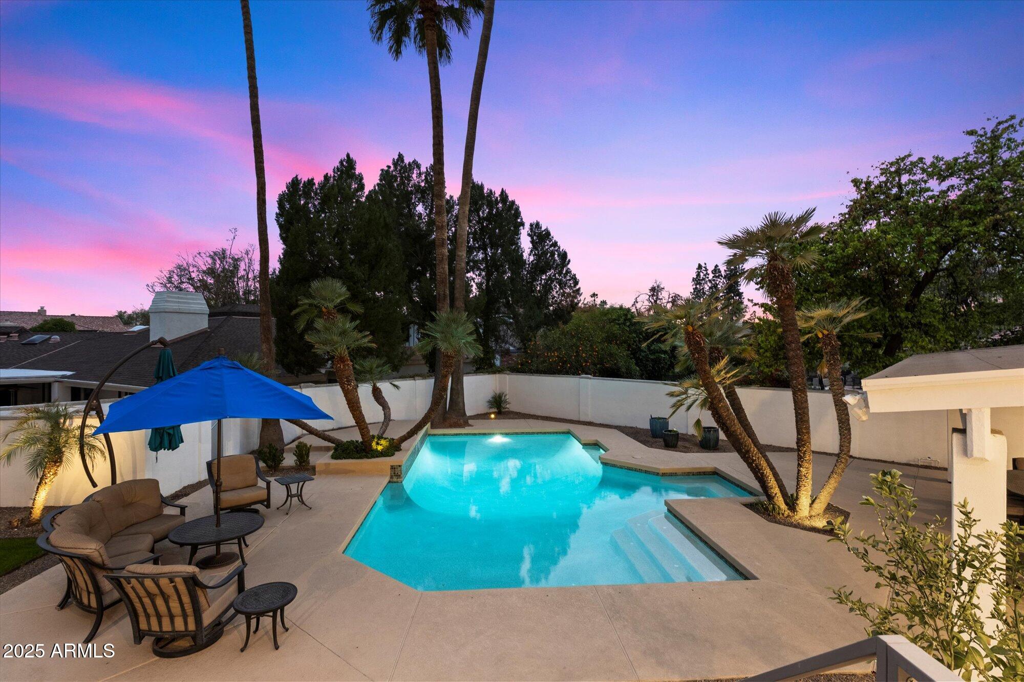 25 West Frier Drive Phoenix, AZ 85021 - Photo 37 of 43 a view of a swimming pool with a yard and furniture