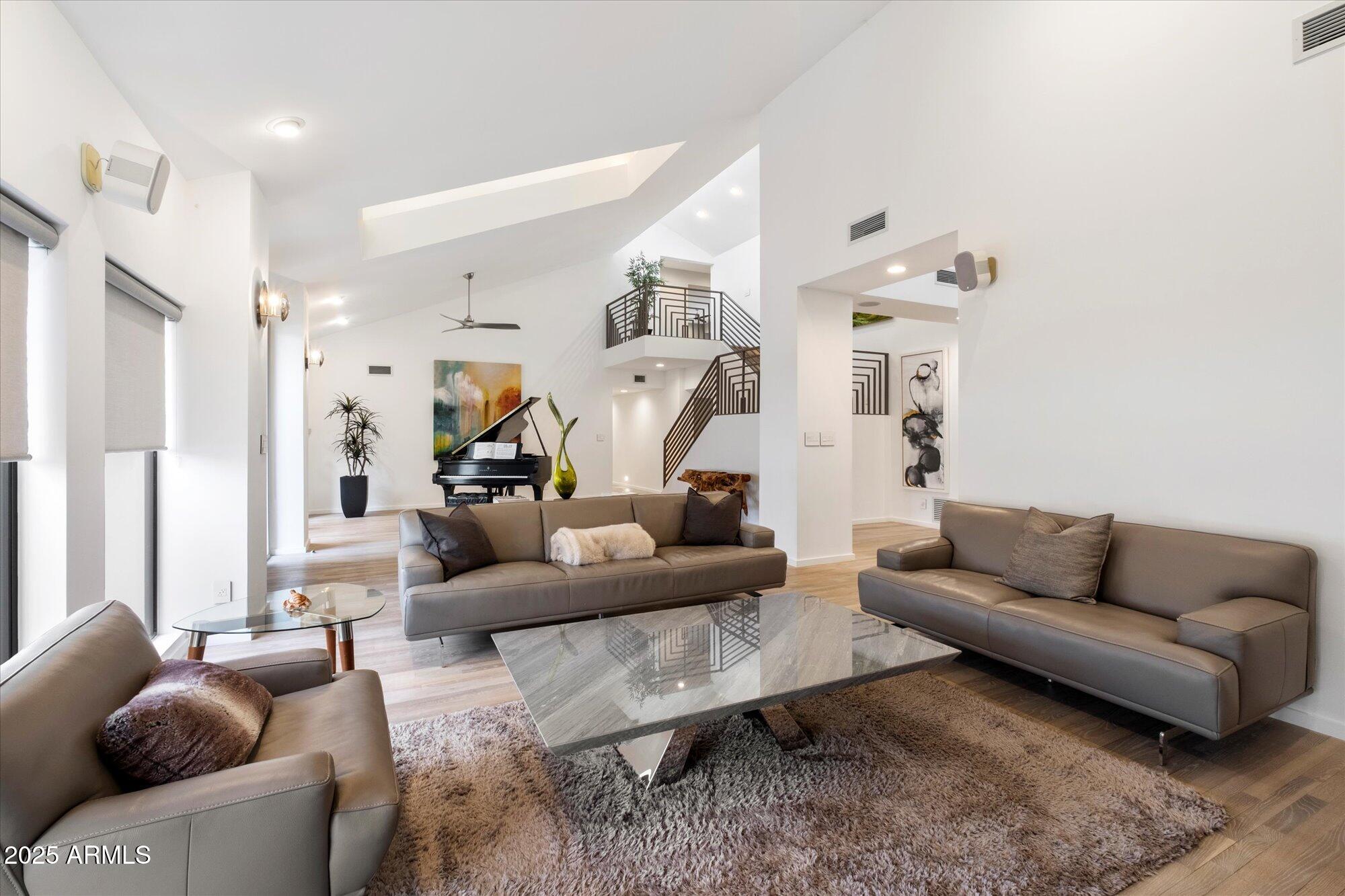 25 West Frier Drive Phoenix, AZ 85021 - Photo 9 of 43 a living room with furniture and a chandelier