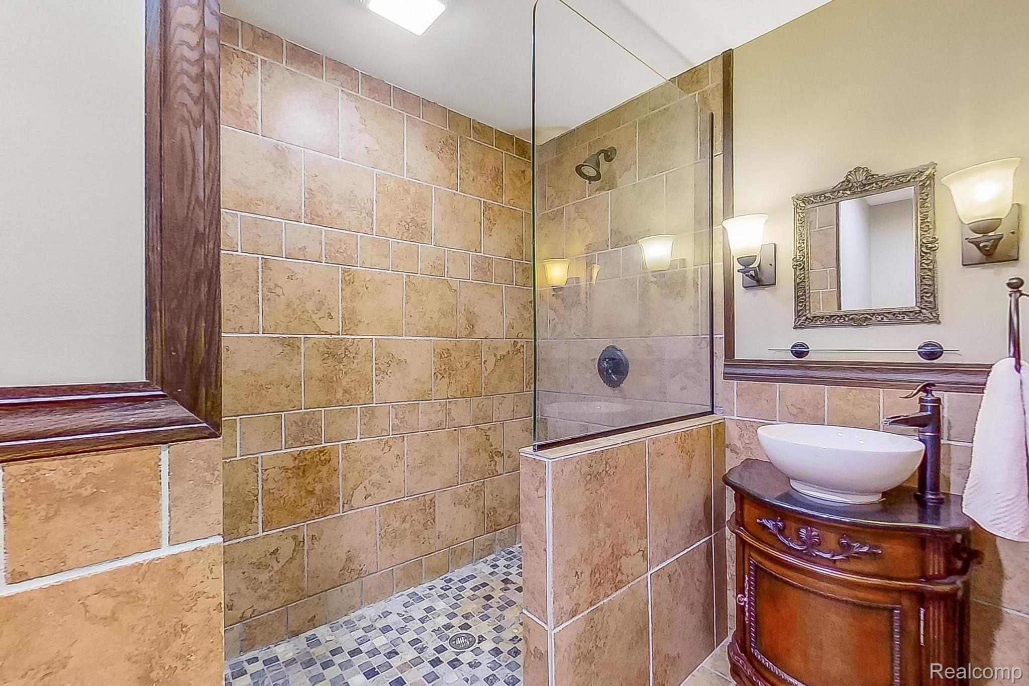 4374 Brogan Road Stockbridge, MI 49285 - Photo 19 of 94 Full bath off laundry, perfect for pool guests