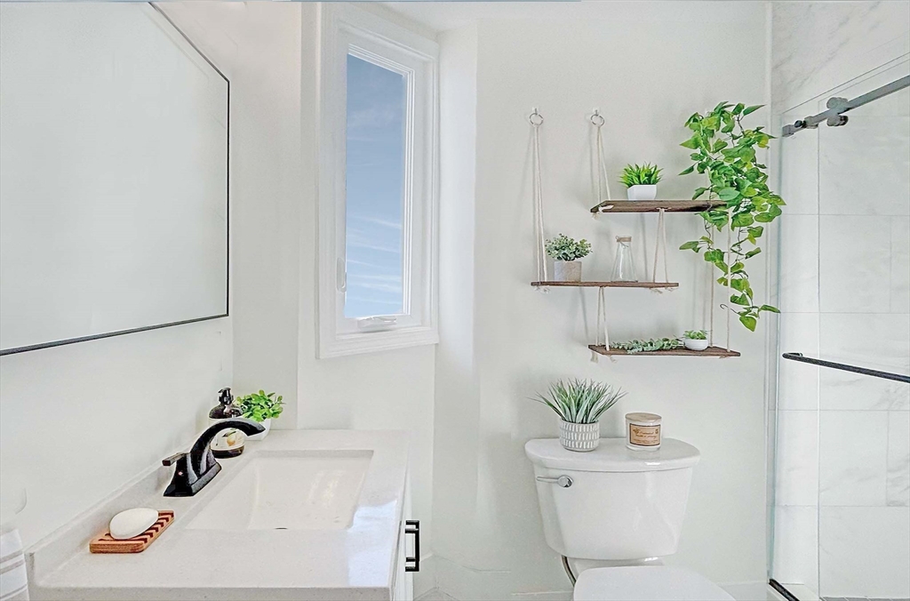 173 Walnut Street, Unit 3 Chelsea, MA 02150 - Photo 6 of 12 a bath room with a sink and a toilet