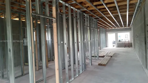 a view of an empty room with a chair