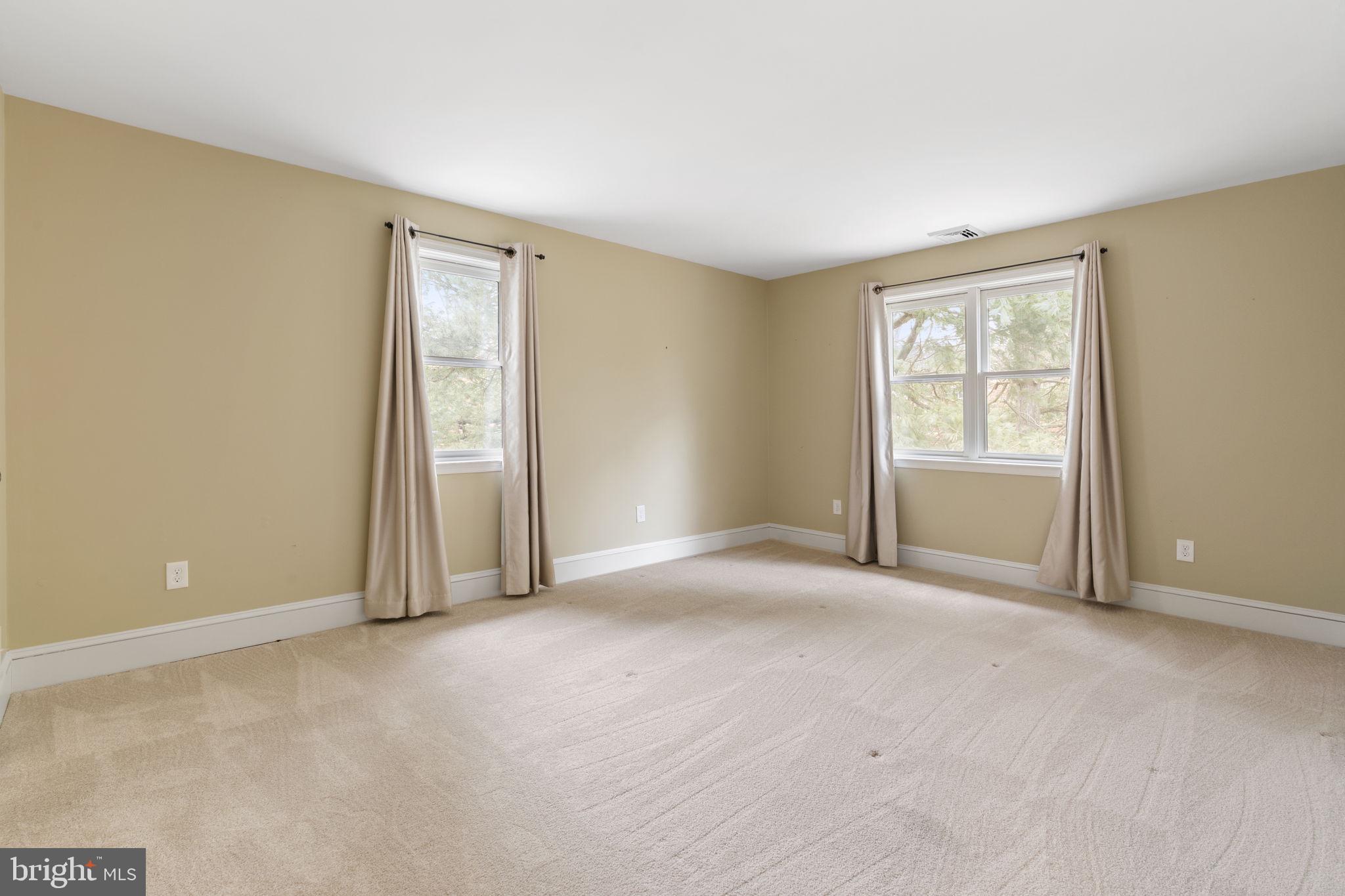115 Roumfort Road, Unit 26 Philadelphia, PA 19119 - Photo 18 of 33 a view of an empty room with a window