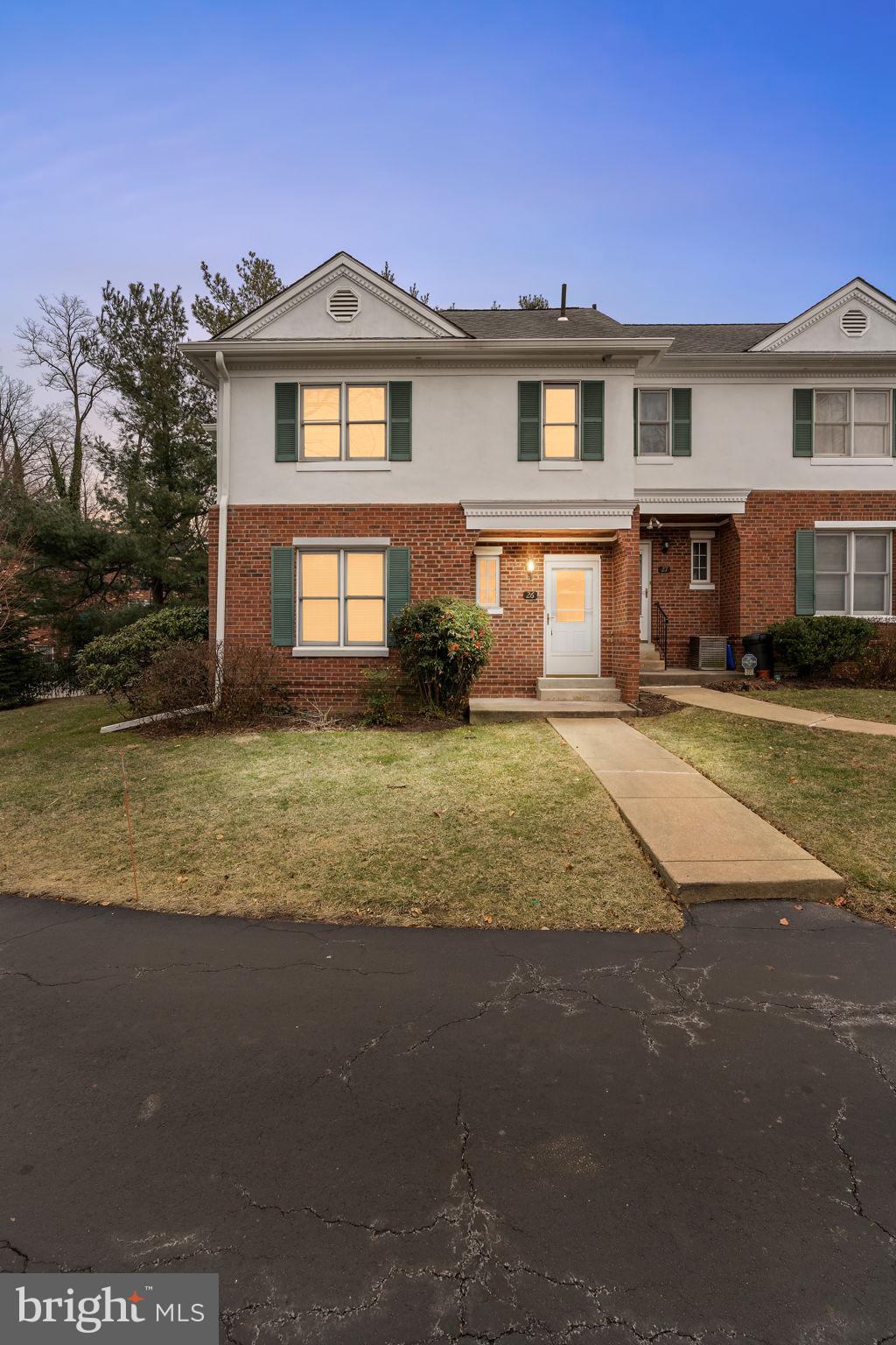 115 Roumfort Road, Unit 26 Philadelphia, PA 19119 - Photo 2 of 33 a front view of a house with yard